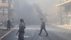  فيديو: تظاهرة لأصحاب المصالح التجارية بيافا تخللها احراق اطارات 